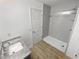Bathroom with gray shower and granite countertop sink at 5431 Village Green Sq # 1018, Norcross, GA 30093