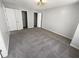 Large bedroom with gray carpeting and double closets at 5431 Village Green Sq # 1018, Norcross, GA 30093