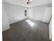 Spacious bedroom with gray carpeting and large window at 5431 Village Green Sq # 1018, Norcross, GA 30093
