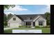 New construction with a two-car garage, shingle accents, craftsman columns, and a flower bed in Canton, GA at 551 Southland Cir, Canton, GA 30115