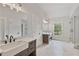 Elegant bathroom with double vanity, large shower, and window at 113 Creekview Ln, Canton, GA 30115