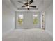 Bright and airy bedroom with plush carpeting and ceiling fan at 113 Creekview Ln, Canton, GA 30115