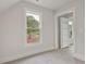 Charming bedroom with a window showcasing a wooded view at 113 Creekview Ln, Canton, GA 30115