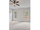 Bright bedroom with carpet flooring and two large windows at 113 Creekview Ln, Canton, GA 30115
