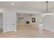 Open concept dining room with hardwood floors and views to the living room at 113 Creekview Ln, Canton, GA 30115
