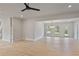 Spacious dining room with hardwood floors and a modern chandelier at 113 Creekview Ln, Canton, GA 30115
