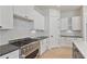 Modern kitchen with stainless steel range and white cabinets at 113 Creekview Ln, Canton, GA 30115