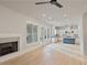 Open concept living room with hardwood floors, fireplace, and kitchen views at 113 Creekview Ln, Canton, GA 30115