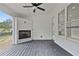 Covered patio with built-in fireplace and access to backyard at 113 Creekview Ln, Canton, GA 30115