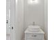Small powder room with a modern vessel sink and white vanity at 113 Creekview Ln, Canton, GA 30115