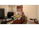Home office features a wood desk and carpeted floor at 3059 Sorrento Sw Cir, Atlanta, GA 30331