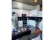 Modern white kitchen with black countertops and stainless steel appliances at 3324 Peachtree Ne Rd # 1206, Atlanta, GA 30326