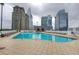 Refreshing rooftop pool with lounge chairs and city views at 3324 Peachtree Ne Rd # 1206, Atlanta, GA 30326