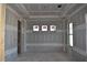 Simple bedroom with drywall and windows, awaiting finishing touches at 5424 Gallaghar Ct, Powder Springs, GA 30127