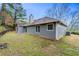 View of the home's backyard featuring a patio and grassy area at 2065 Arbor Forest Sw Dr, Marietta, GA 30064