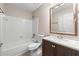 Bathroom featuring a tub-shower combo, vanity with ample storage, and updated fixtures at 2065 Arbor Forest Sw Dr, Marietta, GA 30064