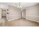 Dining room area showcasing neutral walls, chandelier, and modern wood-look floors at 2065 Arbor Forest Sw Dr, Marietta, GA 30064