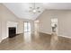 Open-concept living room featuring fireplace, vaulted ceilings, sliding doors, and seamless flow to kitchen at 2065 Arbor Forest Sw Dr, Marietta, GA 30064