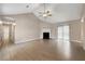 Spacious living room featuring vaulted ceiling, fireplace, fan, and sliding doors to backyard at 2065 Arbor Forest Sw Dr, Marietta, GA 30064