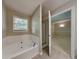 Relaxing bathroom with a large bathtub and shower at 2065 Arbor Forest Sw Dr, Marietta, GA 30064