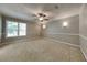 Large bedroom with ceiling fan and neutral wall colors at 2065 Arbor Forest Sw Dr, Marietta, GA 30064