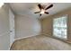 Spacious bedroom with ceiling fan and large window at 2065 Arbor Forest Sw Dr, Marietta, GA 30064