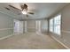Well-lit bedroom with two entry doors and a ceiling fan at 2065 Arbor Forest Sw Dr, Marietta, GA 30064