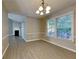 Bright dining area with hardwood floors and a chandelier at 2065 Arbor Forest Sw Dr, Marietta, GA 30064