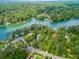 Aerial view of waterfront property with lush greenery at 3860 Adams Rd, Cumming, GA 30041