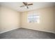 Spacious bedroom with gray carpet and window at 2065 Glenwood Downs Dr, Decatur, GA 30035