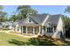 House exterior showcasing a gray two-story home with landscaping at 31 Cedar Gate Ln, Kingston, GA 30145