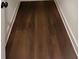 Dark brown hardwood floors in a long hallway at 31 Cedar Gate Ln, Kingston, GA 30145