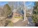 Two-story house with large tree and driveway at 5480 Landseer Way, Cumming, GA 30040