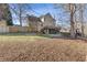 Large backyard with deck and mature trees at 5480 Landseer Way, Cumming, GA 30040