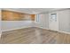 Finished basement with wood-look wall and exterior access at 5480 Landseer Way, Cumming, GA 30040