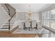 Elegant dining room with hardwood floors and large windows at 5480 Landseer Way, Cumming, GA 30040