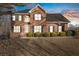 Brick two-story house with a landscaped lawn, nighttime view at 5480 Landseer Way, Cumming, GA 30040