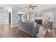 Open living room with hardwood floors, fireplace, and built-in shelving at 5480 Landseer Way, Cumming, GA 30040