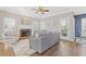 Spacious living room with hardwood floors, fireplace, and lots of natural light at 5480 Landseer Way, Cumming, GA 30040