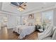 Spacious main bedroom with wood floors and ensuite bathroom at 5480 Landseer Way, Cumming, GA 30040