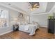 Main bedroom featuring hardwood floors and tray ceiling at 5480 Landseer Way, Cumming, GA 30040