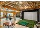 Basement with home gym and golf simulator setup at 830 Camden Park Ne Ct, Atlanta, GA 30342