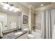 Clean bathroom with a shower/tub combo and granite vanity at 830 Camden Park Ne Ct, Atlanta, GA 30342