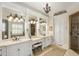 Spa-like bathroom featuring double vanities, a shower, and a chandelier at 830 Camden Park Ne Ct, Atlanta, GA 30342