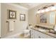 Well-appointed bathroom with granite vanity and updated fixtures at 830 Camden Park Ne Ct, Atlanta, GA 30342