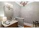 Elegant powder room features designer wallpaper and marble vanity at 830 Camden Park Ne Ct, Atlanta, GA 30342