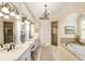 Elegant bathroom with double vanities, soaking tub, and separate shower at 830 Camden Park Ne Ct, Atlanta, GA 30342