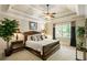 Comfortable bedroom with a queen-size bed and a ceiling fan at 830 Camden Park Ne Ct, Atlanta, GA 30342