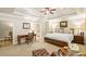 Main bedroom with sitting area, ensuite bathroom, and large windows at 830 Camden Park Ne Ct, Atlanta, GA 30342
