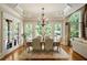 Bright dining room with hardwood floors, large windows, and access to backyard at 830 Camden Park Ne Ct, Atlanta, GA 30342